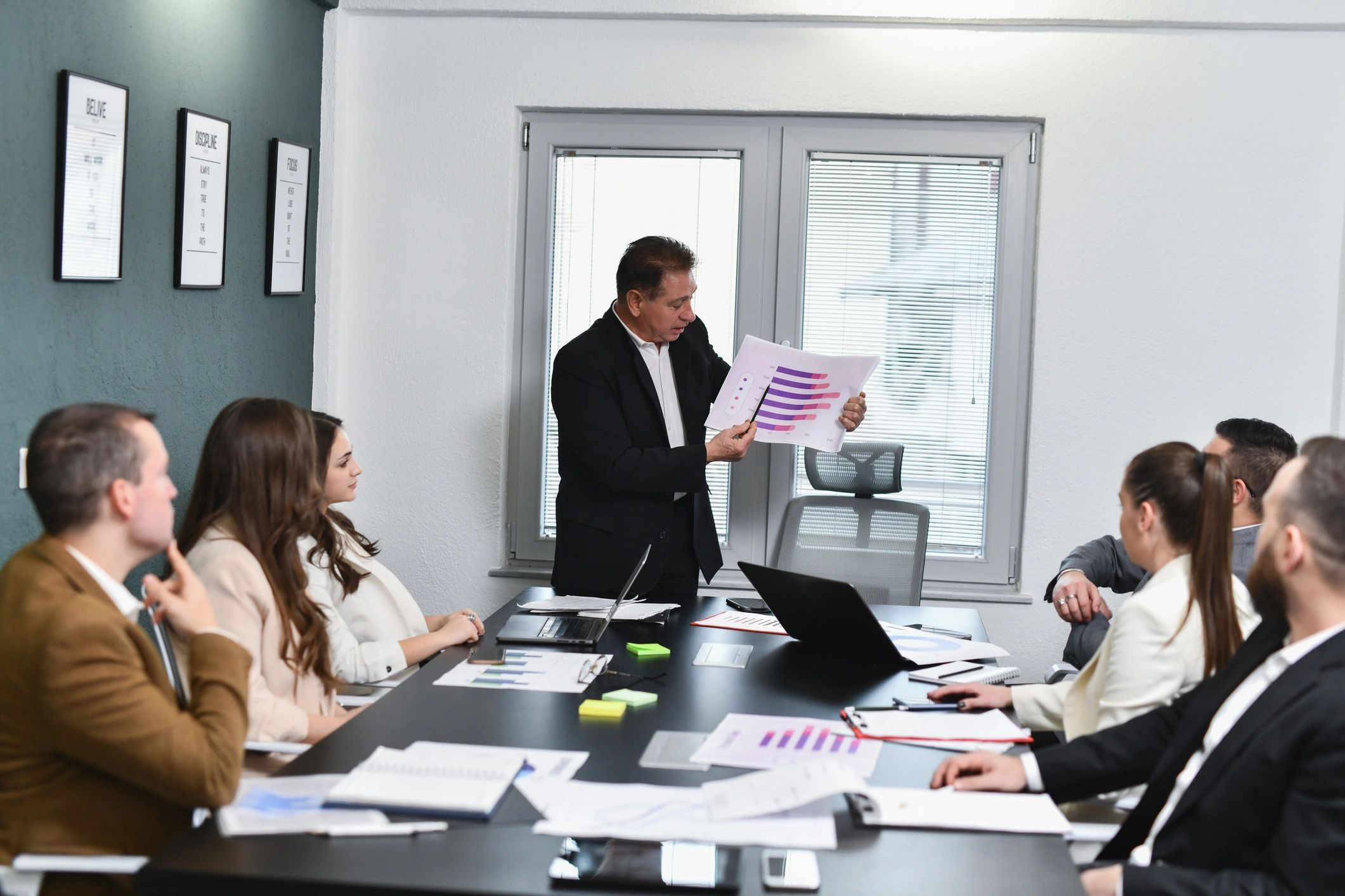 Team listening to a business presentation in an office
