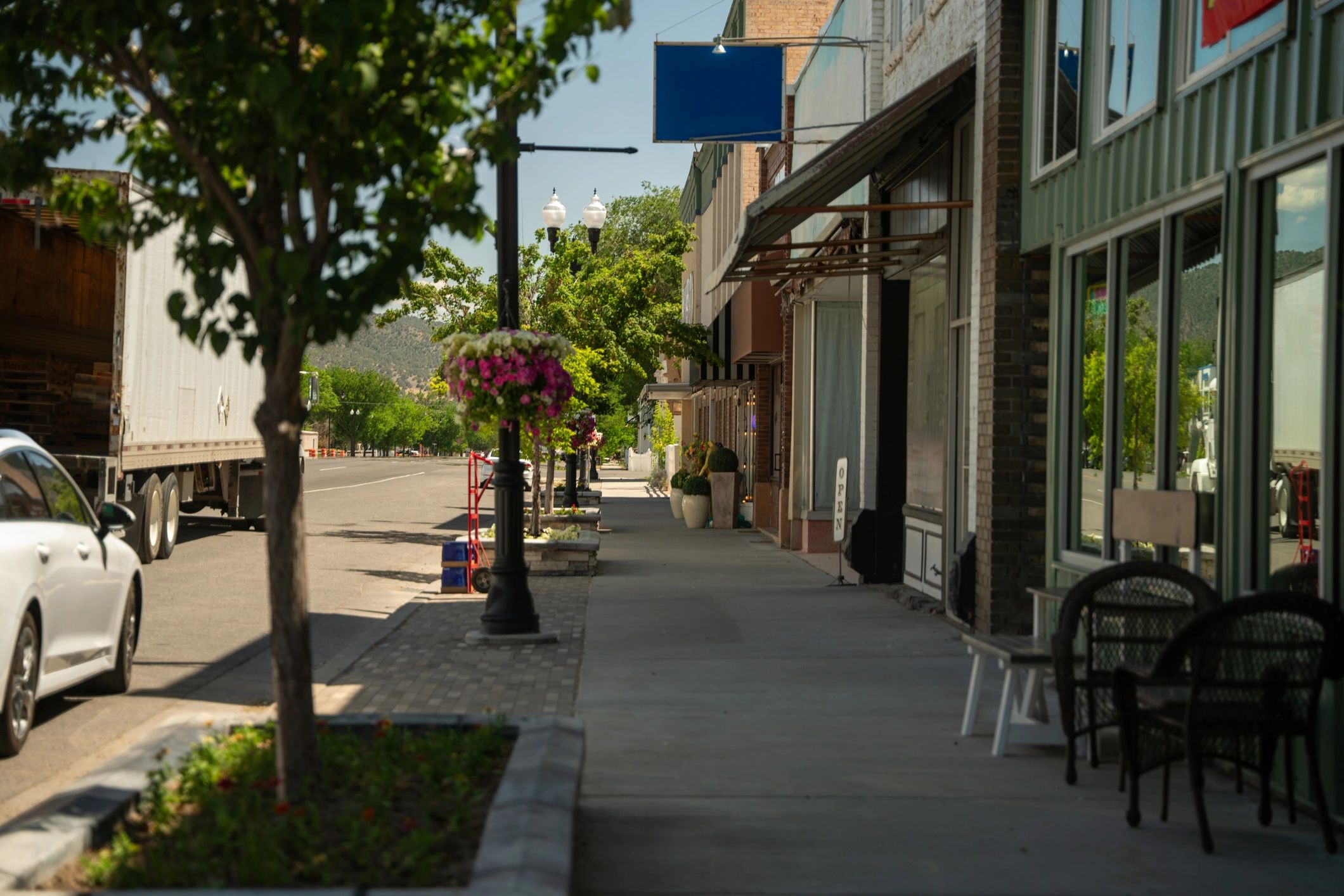 Small town main street with storefronts and sidewalks
