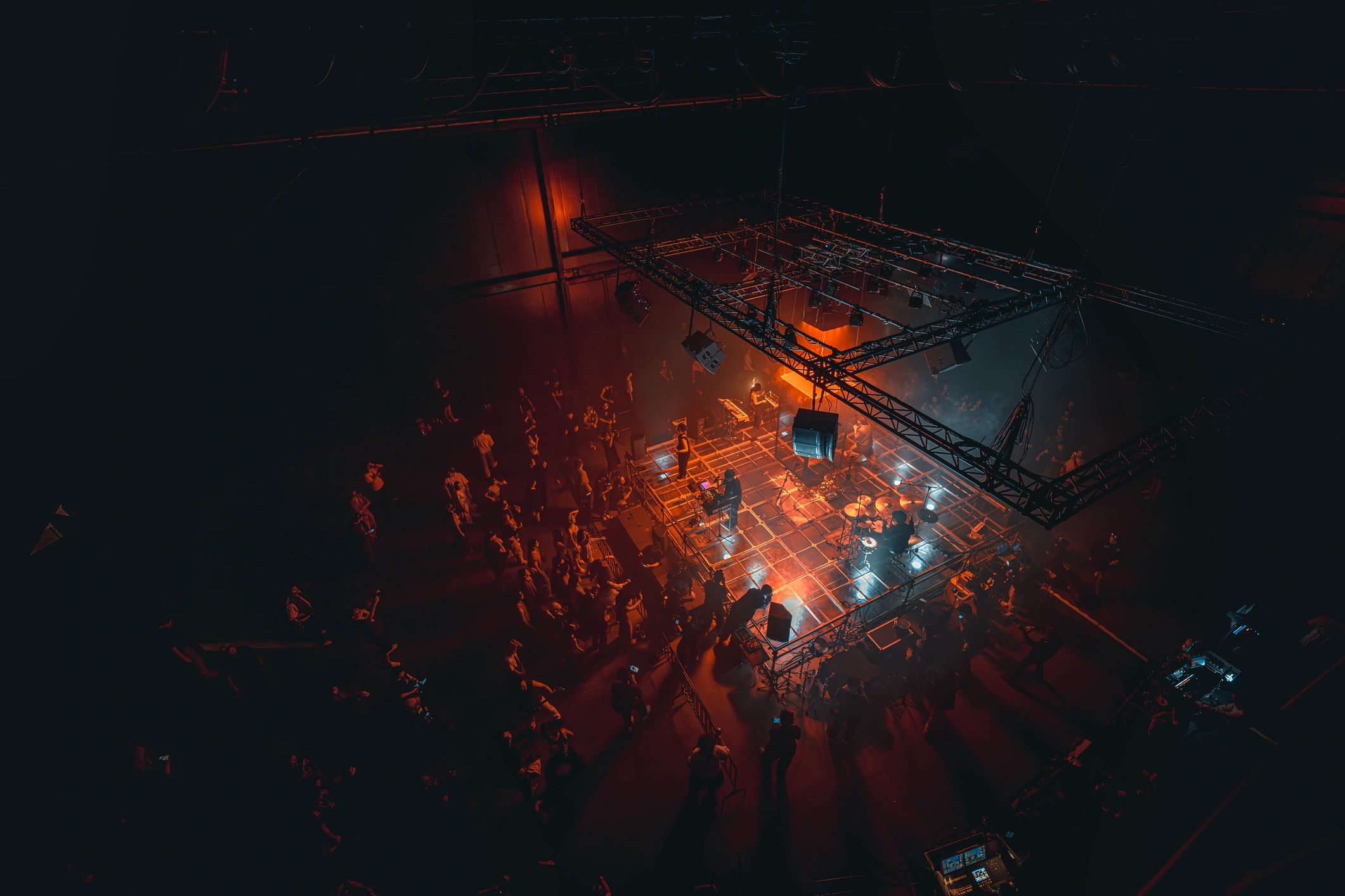 Live musicians performing on a lit concert stage